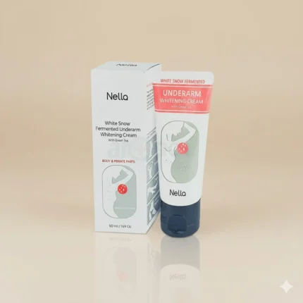 A photorealistic, studio-quality product photo of Nella White Snow Fermented Underarm Whitening Cream with Green Tea. The product, consisting of a white box and a white tube with a black cap, is sharply in focus and positioned against a soft, matte beige background. The lighting is bright and diffused, creating a premium aesthetic with subtle reflections beneath the product. The box and tube both feature red accents and text, highlighting the product name and key benefits.